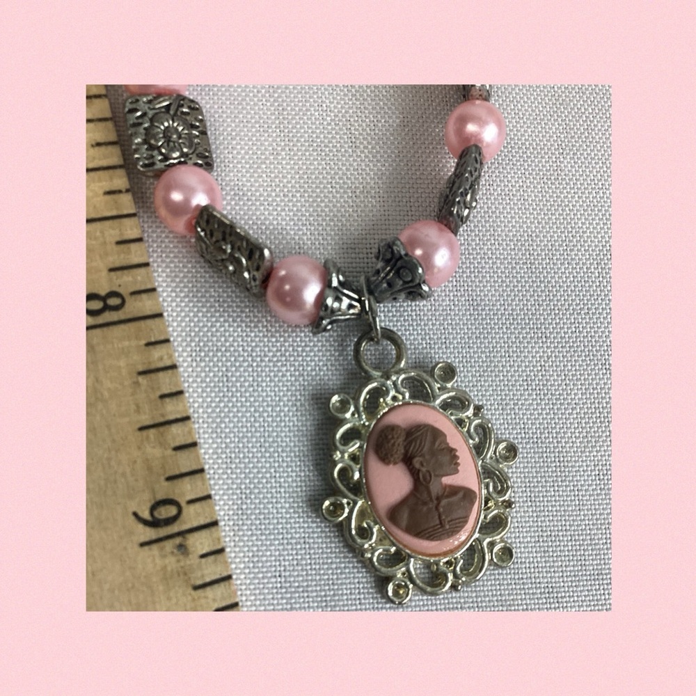 Light pink with sliver,cameo necklace.